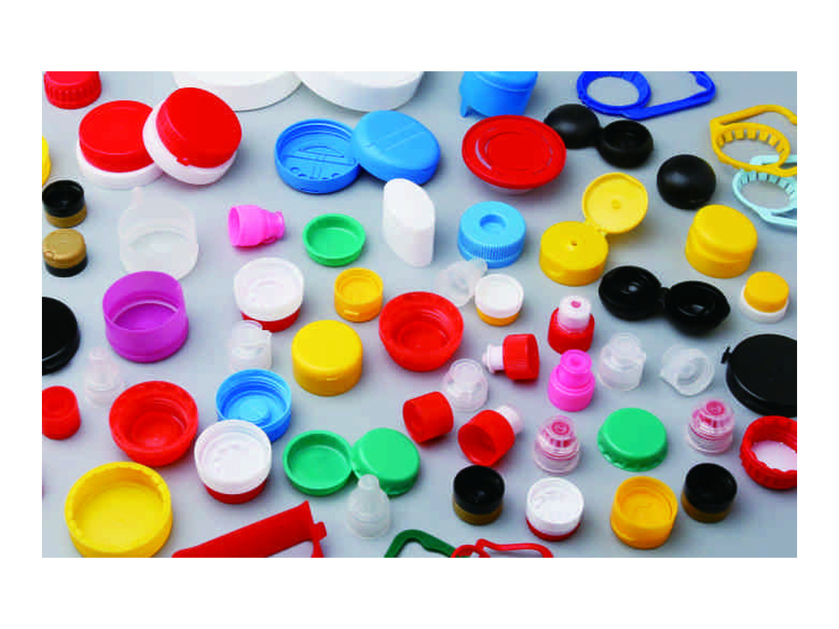 Cap and closure examples from the brochure; not an output specification for this particular mould.